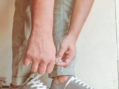 Close-up of a person's hands gripping the floor during a push-up.